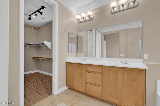 9975 Sand Key St, Las Vegas, NV 89178 - full bathroom featuring double vanity, ornamental molding, a spacious closet, and track lighting