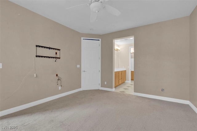9975 Sand Key St, Las Vegas, NV 89178 - unfurnished bedroom featuring light colored carpet, ensuite bath, and ceiling fan