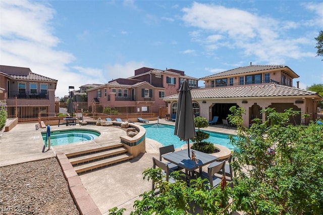 9975 Sand Key St, Las Vegas, NV 89178 - community pool featuring a hot tub, a patio area, and a residential view