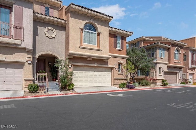 9975 Sand Key St, Las Vegas, NV 89178 - multi unit property featuring stucco siding, a garage, and a tile roof