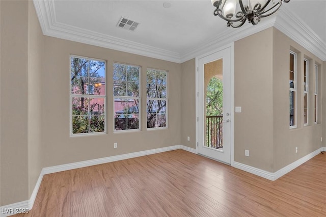 9975 Sand Key St, Las Vegas, NV 89178 - foyer with a chandelier, plenty of natural light, wood finished floors, and crown molding