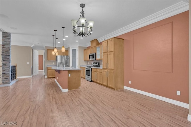 9975 Sand Key St, Las Vegas, NV 89178 - kitchen featuring appliances with stainless steel finishes, light countertops, a kitchen bar, a chandelier, and light wood-style flooring