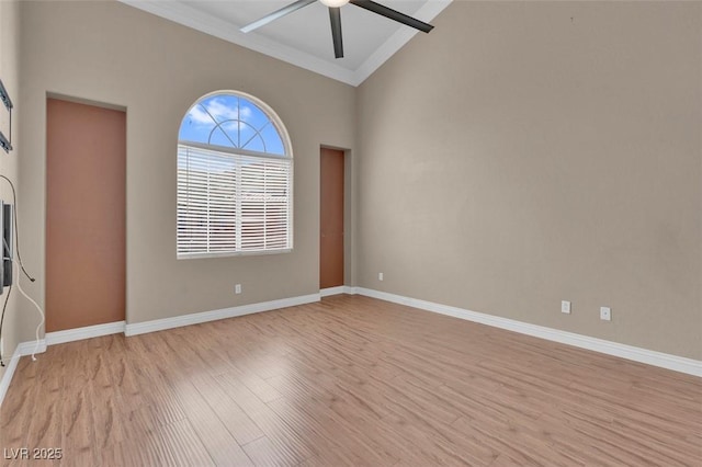 9975 Sand Key St, Las Vegas, NV 89178 - spare room with crown molding, ceiling fan, light wood finished floors, and lofted ceiling