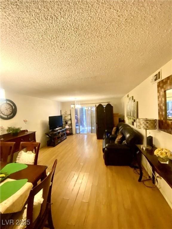 1748 Jupiter Ct Unit C, Las Vegas, NV 89119 - living room with a textured ceiling and wood finished floors