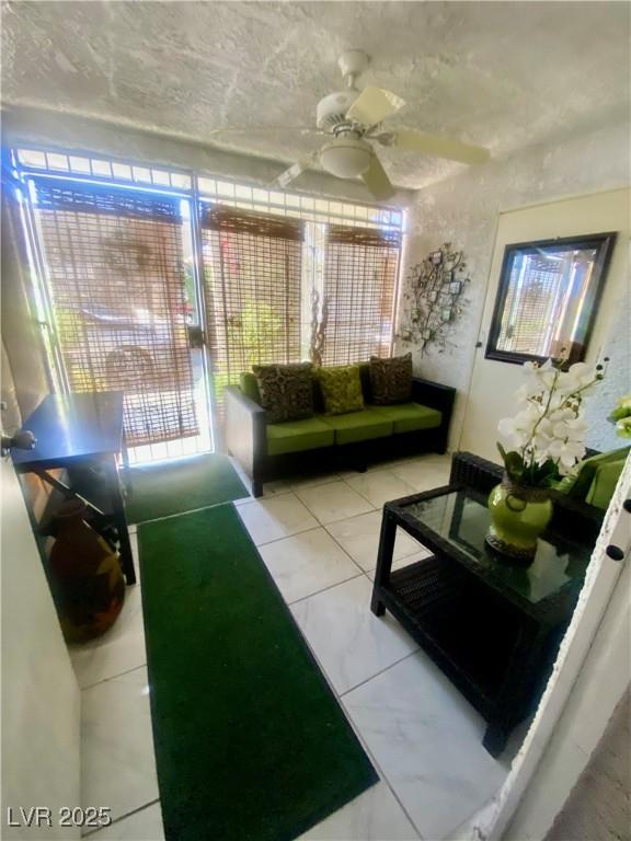 1748 Jupiter Ct Unit C, Las Vegas, NV 89119 - living area featuring a ceiling fan