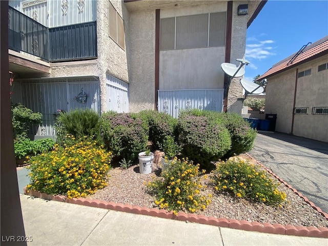 1748 Jupiter Ct Unit C, Las Vegas, NV 89119 - view of home's exterior with stucco siding and a balcony