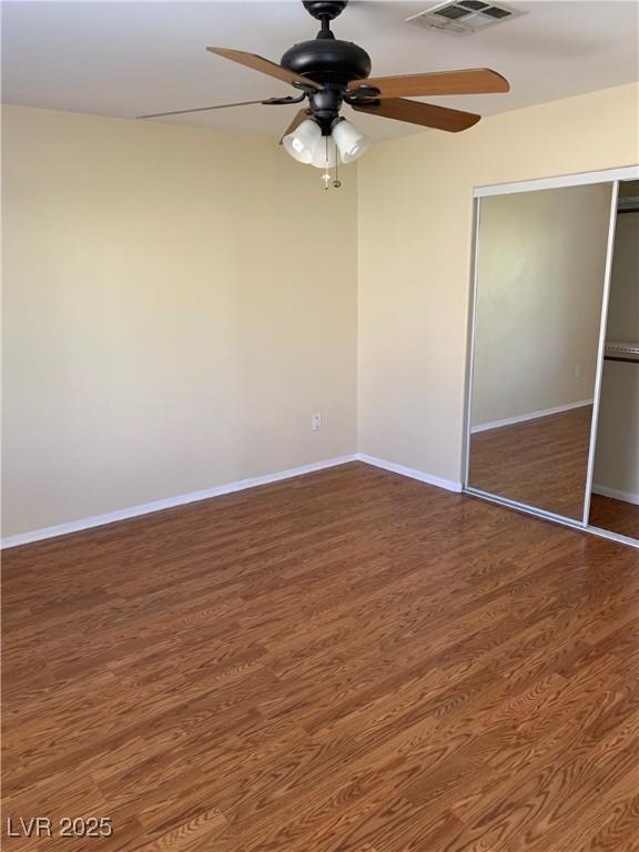 533 Via Santiago St, Las Vegas, NV 89144 - unfurnished bedroom with a closet, wood finished floors, baseboards, and ceiling fan