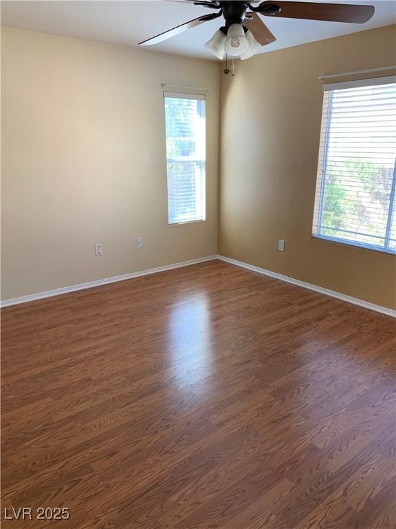 533 Via Santiago St, Las Vegas, NV 89144 - empty room featuring a ceiling fan, healthy amount of natural light, and dark wood-style floors