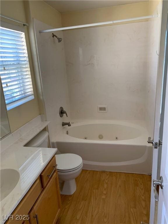 533 Via Santiago St, Las Vegas, NV 89144 - bathroom featuring wood finished floors, vanity, toilet, and bathing tub / shower combination