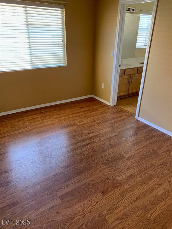 533 Via Santiago St, Las Vegas, NV 89144 - empty room featuring wood finished floors, plenty of natural light, and baseboards