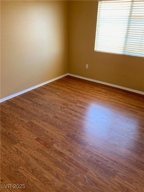 533 Via Santiago St, Las Vegas, NV 89144 - empty room with baseboards and dark wood-type flooring