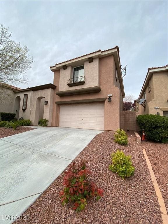 533 Via Santiago St, Las Vegas, NV 89144 - mediterranean / spanish-style house featuring stucco siding, concrete driveway, an attached garage, and a tiled roof