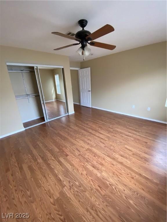 533 Via Santiago St, Las Vegas, NV 89144 - unfurnished bedroom with wood finished floors, baseboards, a closet, and ceiling fan