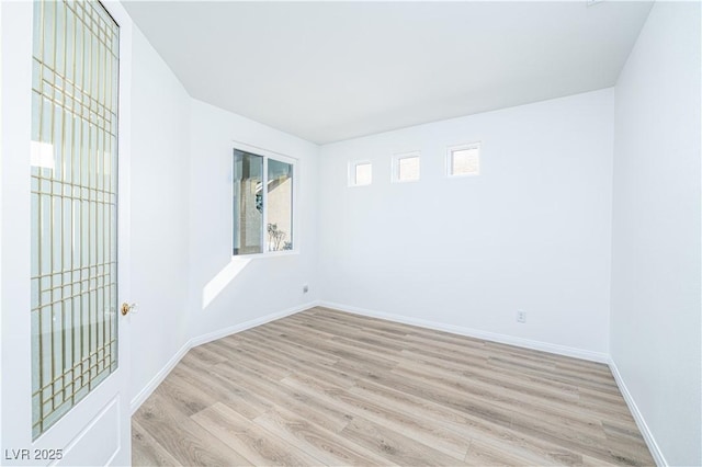669 Elliot Peak Ave, Las Vegas, NV 89183 - spare room with light wood-type flooring and baseboards