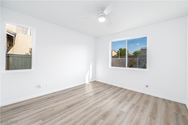 669 Elliot Peak Ave, Las Vegas, NV 89183 - empty room with wood finished floors, a ceiling fan, and baseboards
