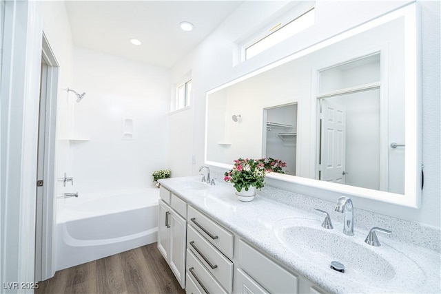 669 Elliot Peak Ave, Las Vegas, NV 89183 - full bathroom featuring double vanity, wood finished floors, shower / washtub combination, and recessed lighting