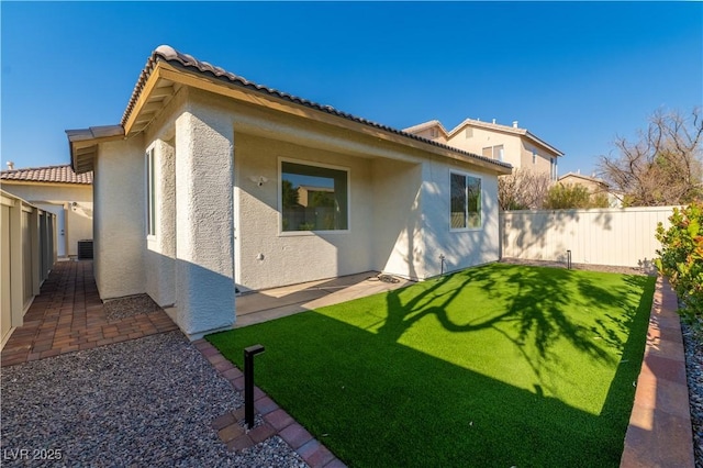 669 Elliot Peak Ave, Las Vegas, NV 89183 - back of house featuring stucco siding, a tiled roof, a patio area, and central air condition unit