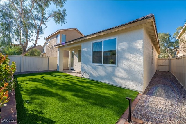 669 Elliot Peak Ave, Las Vegas, NV 89183 - back of property featuring stucco siding and a tiled roof