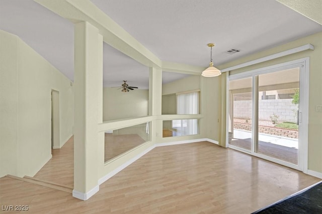 9746 Driftwood Island Ct, Las Vegas, NV 89148 - unfurnished room with baseboards, wood finished floors, and a ceiling fan