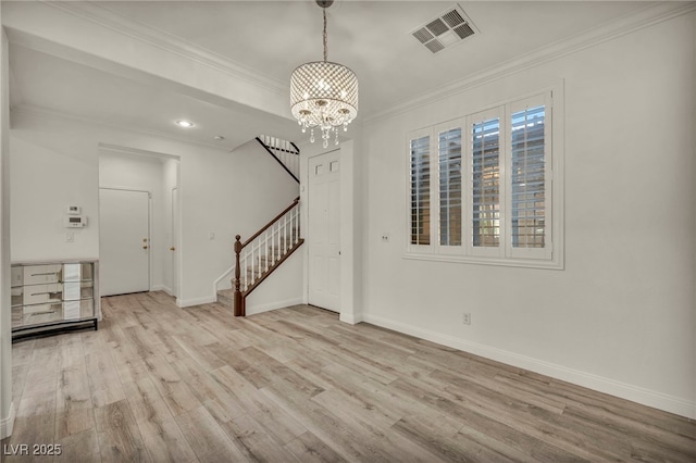 5553 Coral Gate St, Las Vegas, NV 89148 - unfurnished living room with stairs, wood finished floors, a chandelier, crown molding, and baseboards