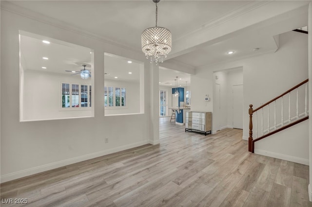 5553 Coral Gate St, Las Vegas, NV 89148 - unfurnished room featuring ornamental molding, light wood finished floors, a chandelier, baseboards, and stairway