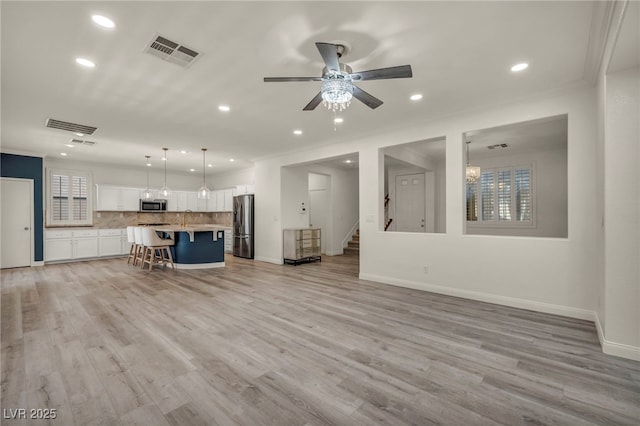 5553 Coral Gate St, Las Vegas, NV 89148 - living area with recessed lighting, light wood finished floors, stairway, baseboards, and a ceiling fan
