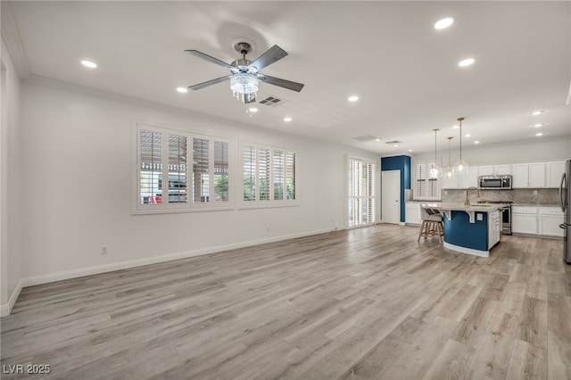 5553 Coral Gate St, Las Vegas, NV 89148 - unfurnished living room featuring recessed lighting, a ceiling fan, a sink, light wood-style flooring, and baseboards