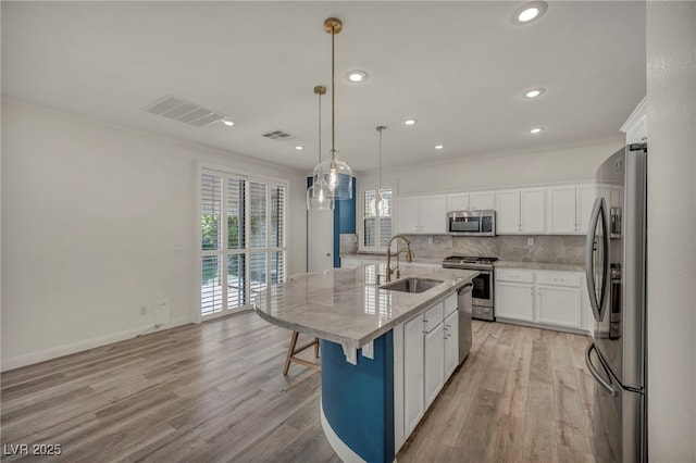 5553 Coral Gate St, Las Vegas, NV 89148 - kitchen featuring appliances with stainless steel finishes, a sink, crown molding, backsplash, and recessed lighting