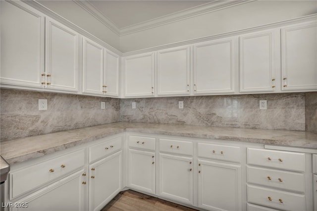 5553 Coral Gate St, Las Vegas, NV 89148 - kitchen with crown molding, white cabinets, and decorative backsplash