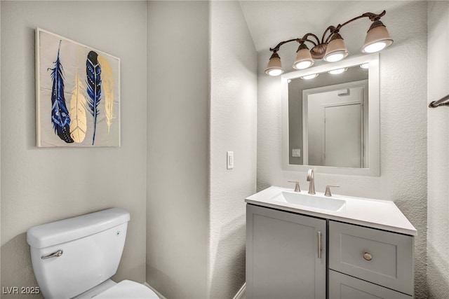 5553 Coral Gate St, Las Vegas, NV 89148 - half bathroom with toilet, vanity, and a textured wall