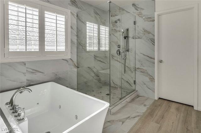5553 Coral Gate St, Las Vegas, NV 89148 - bathroom featuring a tub with jets, a marble finish shower, a sink, and wood finished floors