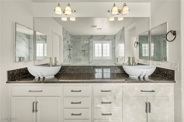 5553 Coral Gate St, Las Vegas, NV 89148 - bathroom featuring a marble finish shower and double vanity