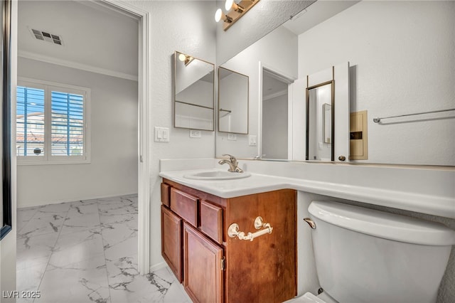 5553 Coral Gate St, Las Vegas, NV 89148 - bathroom featuring vanity, marble finish flooring, toilet, ornamental molding, and baseboards