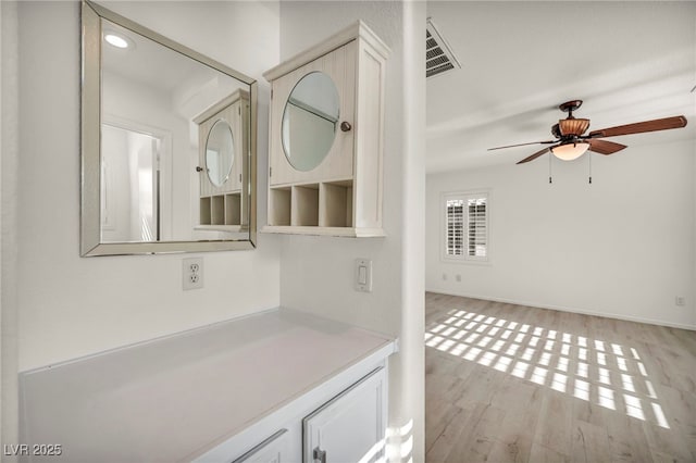 5553 Coral Gate St, Las Vegas, NV 89148 - bathroom featuring a ceiling fan, wood finished floors, vanity, baseboards, and recessed lighting