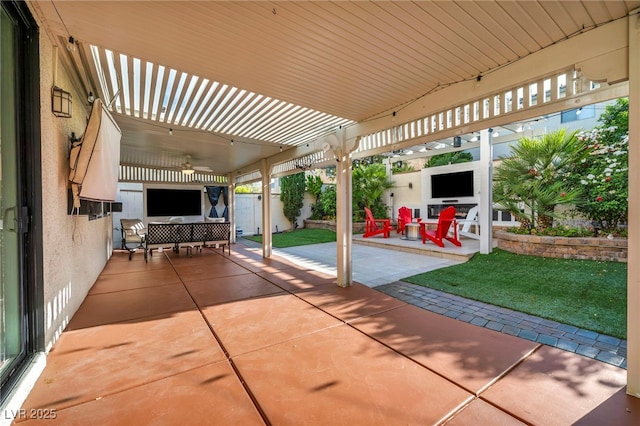 5553 Coral Gate St, Las Vegas, NV 89148 - fenced backyard with a patio area and a ceiling fan