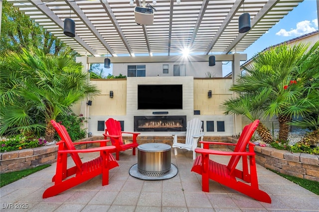 5553 Coral Gate St, Las Vegas, NV 89148 - view of patio / terrace with a glass covered fireplace and a pergola