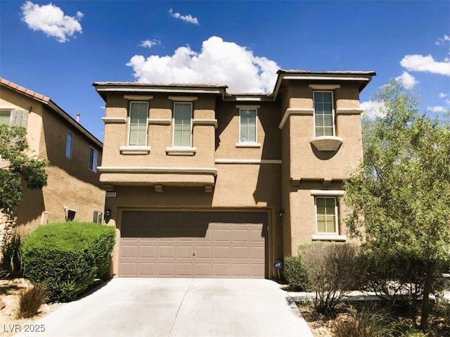 8550 Bright Bush St, Las Vegas, NV 89131 - view of front of home with concrete driveway, an attached garage, and stucco siding