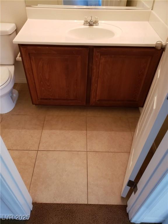 8550 Bright Bush St, Las Vegas, NV 89131 - bathroom featuring vanity, toilet, and tile patterned flooring