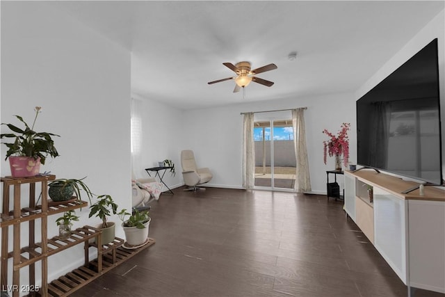 1628 Patricia St, North Las Vegas, NV 89030 - sitting room featuring a ceiling fan, baseboards, and dark wood finished floors