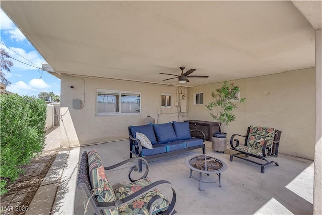 1628 Patricia St, North Las Vegas, NV 89030 - view of patio featuring an outdoor living space with a fire pit and ceiling fan