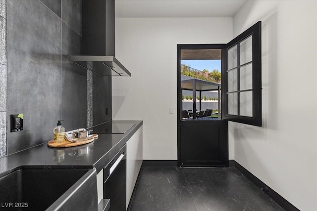 38 Skybird Ct, Las Vegas, NV 89135 - laundry area with baseboards and dark marble finish flooring