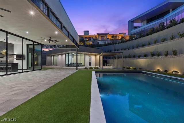 38 Skybird Ct, Las Vegas, NV 89135 - pool at dusk with a ceiling fan and a patio area