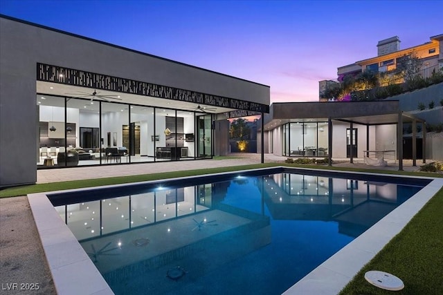38 Skybird Ct, Las Vegas, NV 89135 - pool at dusk with an outdoor pool and a patio