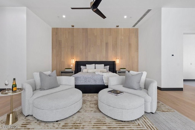 38 Skybird Ct, Las Vegas, NV 89135 - bedroom featuring wooden walls, wood finished floors, recessed lighting, baseboards, and ceiling fan