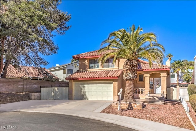 8932 Beach Front Dr, Las Vegas, NV 89117 - mediterranean / spanish-style house with a tile roof, stucco siding, concrete driveway, and a garage