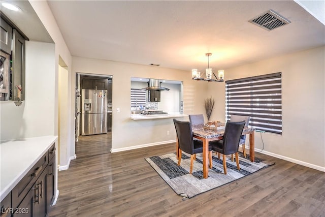 8932 Beach Front Dr, Las Vegas, NV 89117 - dining space with a chandelier, dark wood-style floors, and baseboards