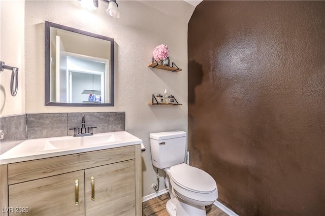 8932 Beach Front Dr, Las Vegas, NV 89117 - bathroom featuring toilet, vanity, and wood finished floors