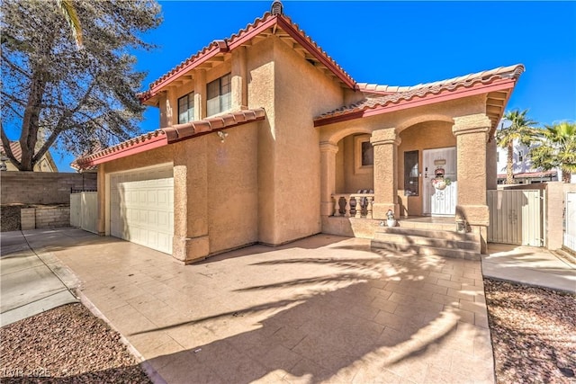 8932 Beach Front Dr, Las Vegas, NV 89117 - mediterranean / spanish-style home featuring a tiled roof, concrete driveway, and stucco siding