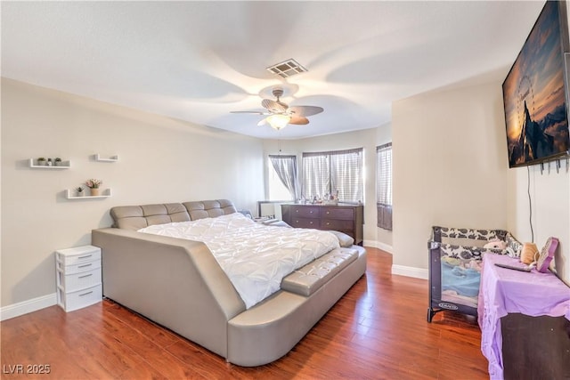 8932 Beach Front Dr, Las Vegas, NV 89117 - bedroom featuring baseboards, wood finished floors, and ceiling fan