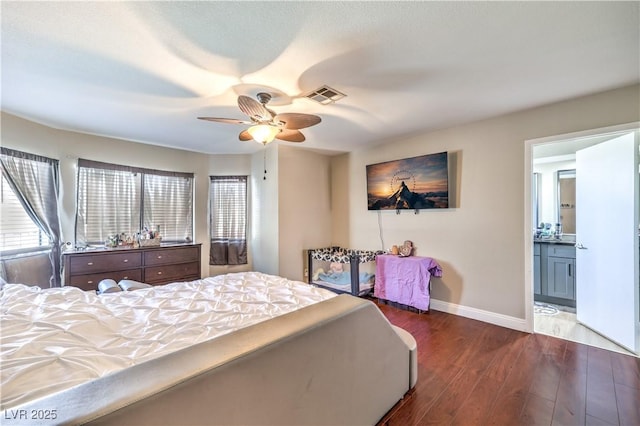 8932 Beach Front Dr, Las Vegas, NV 89117 - bedroom featuring wood finished floors, baseboards, multiple windows, and connected bathroom